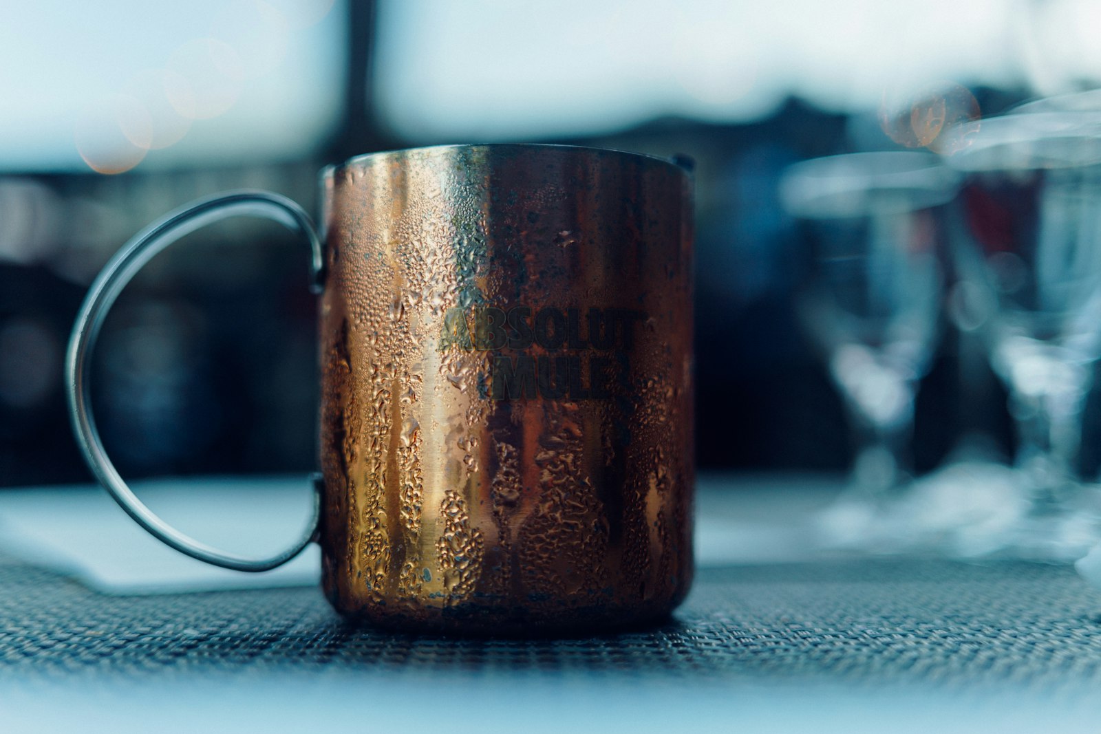 A stemmed glass, a ceramic mug and an Irish coffee glass filled with warm spiced drinks.