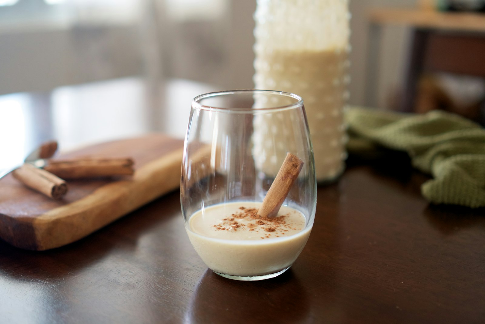 Alcohol-free eggnog in a small tumbler with freshly grated nutmeg on top