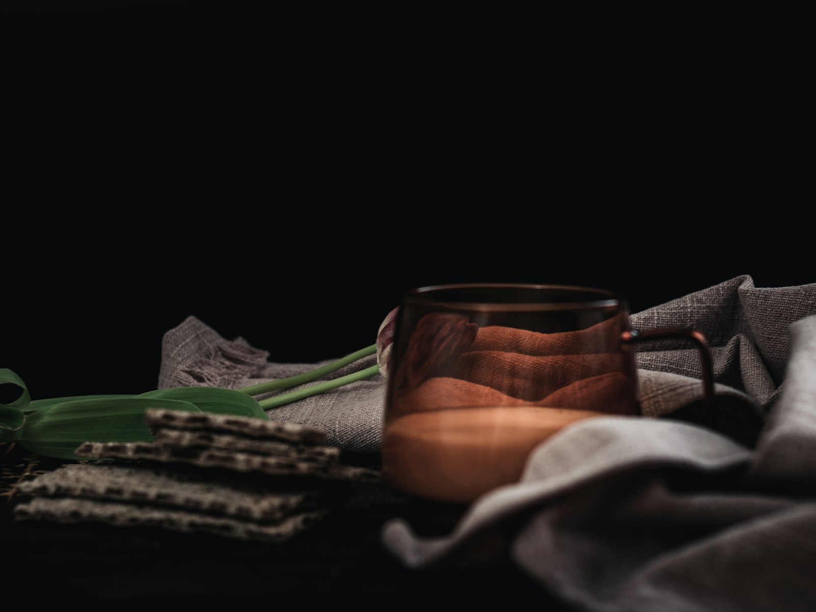 Alcohol-free mulled wine in a heatproof glass with orange slice, cinnamon stick and star anise