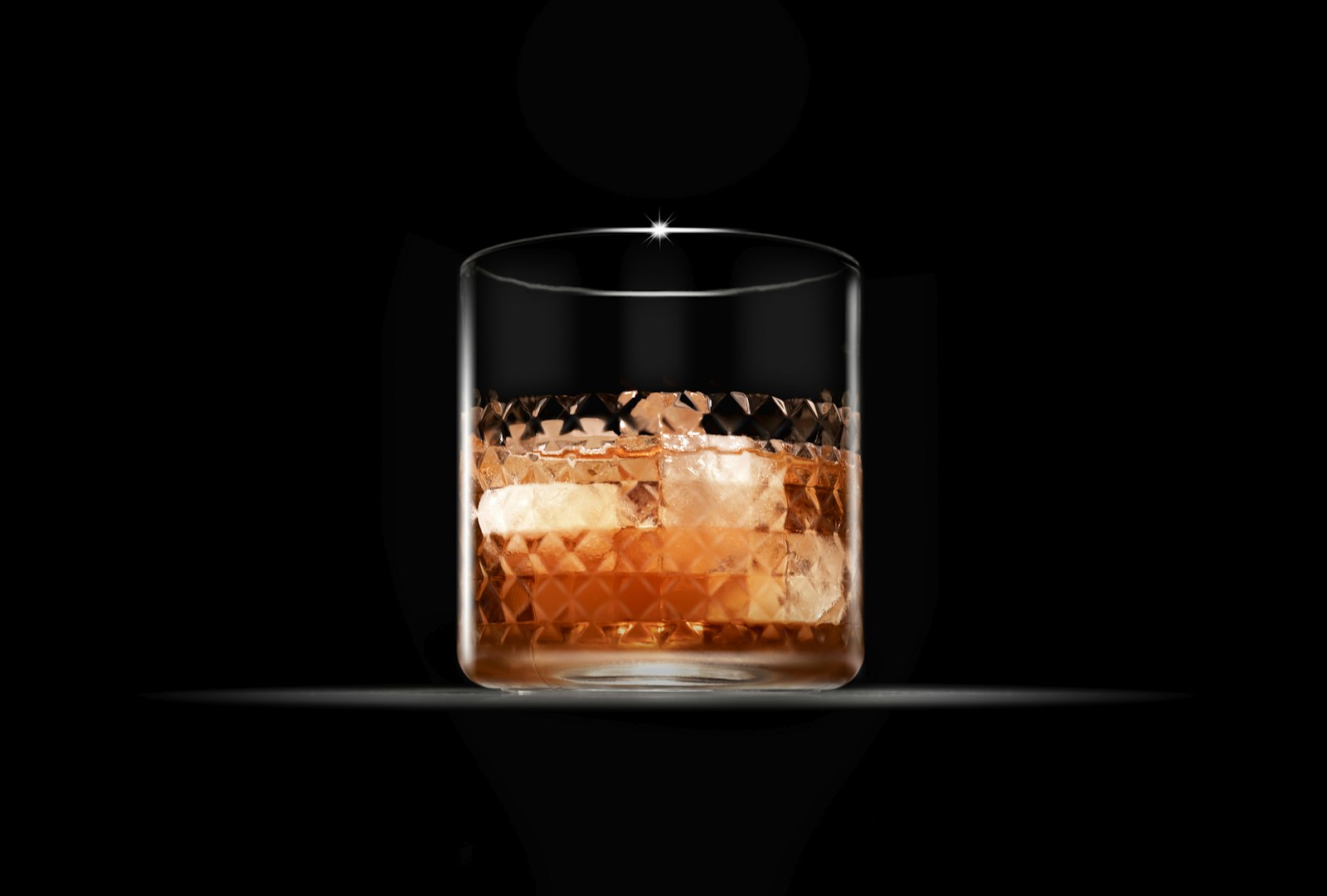 Black Russian cocktail in a rocks glass with a large ice cube and dark coffee liqueur swirl