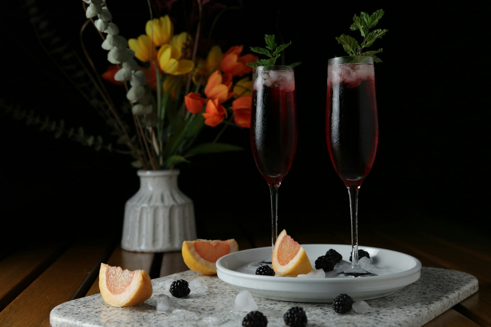 A pink Cranberry Prosecco Sparkler in a flute with sugared cranberries