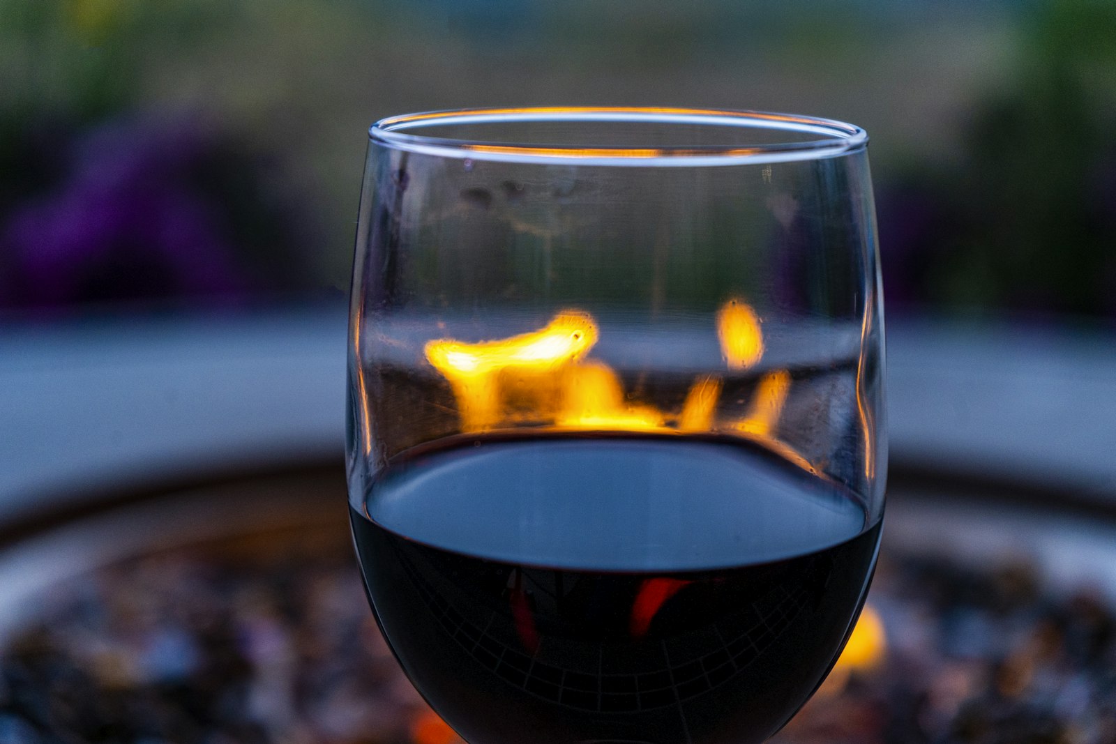 A pan of spiced red wine with a flaming rum-soaked sugarloaf dripping caramelised sugar into it.