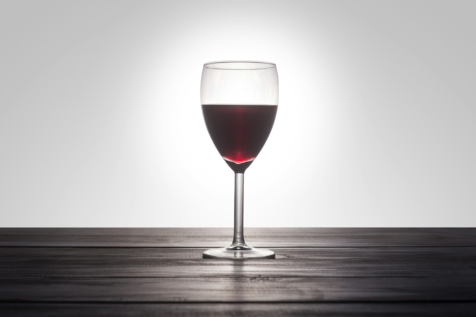 French Connection cocktail with cognac and amaretto over a large ice cube in a rocks glass
