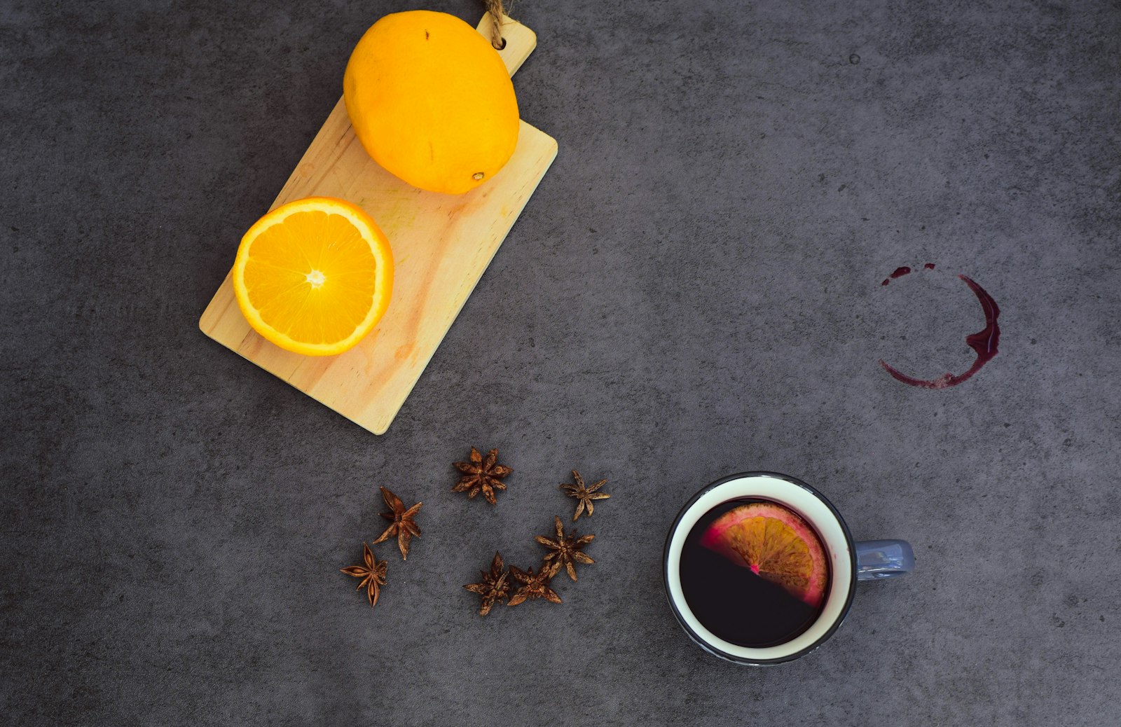 A small glass of dark Nordic glögg with raisins and blanched almonds settled at the bottom.
