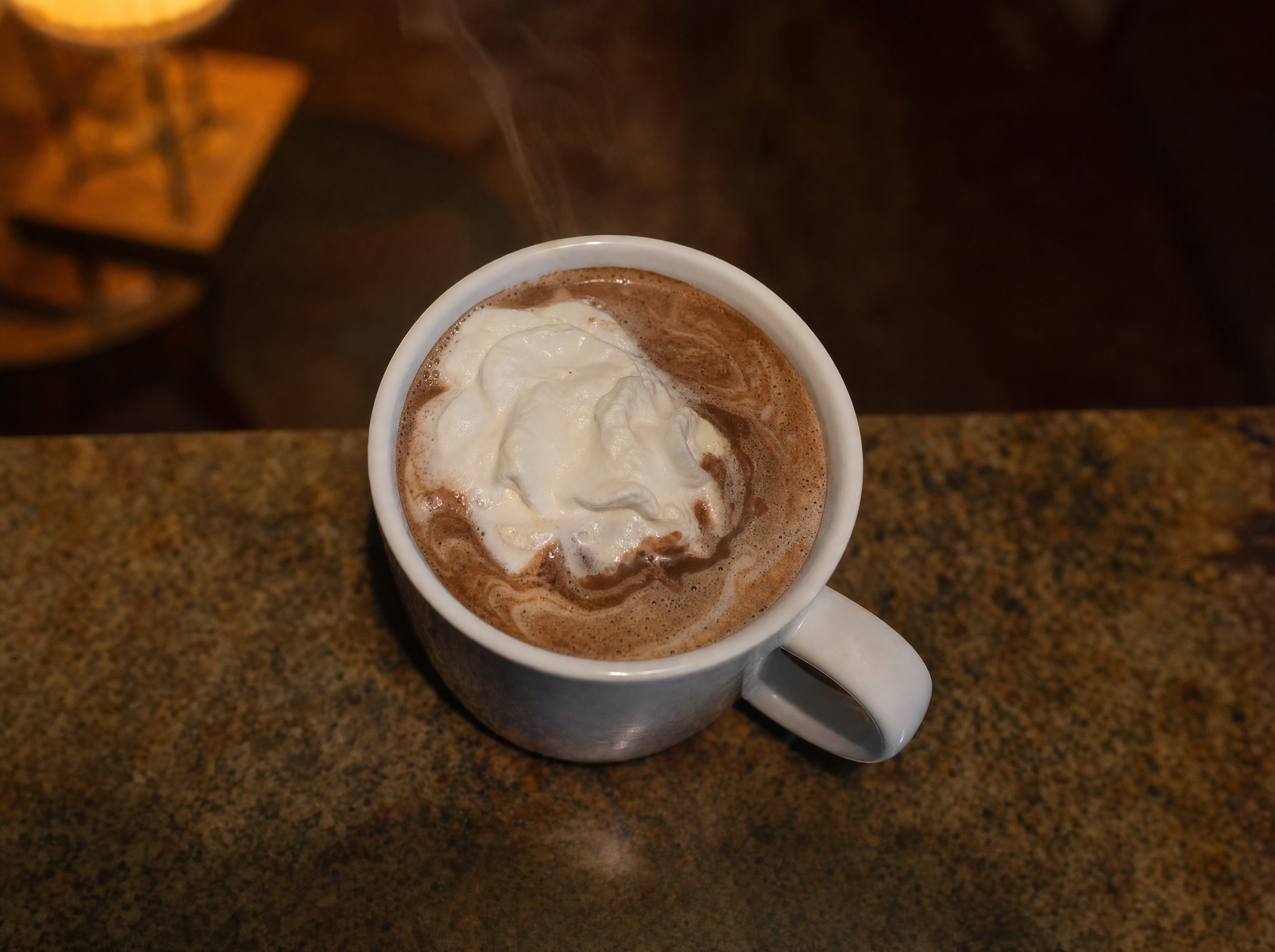 Hot Irish cocoa in a heatproof mug topped with whipped cream and a dusting of nutmeg