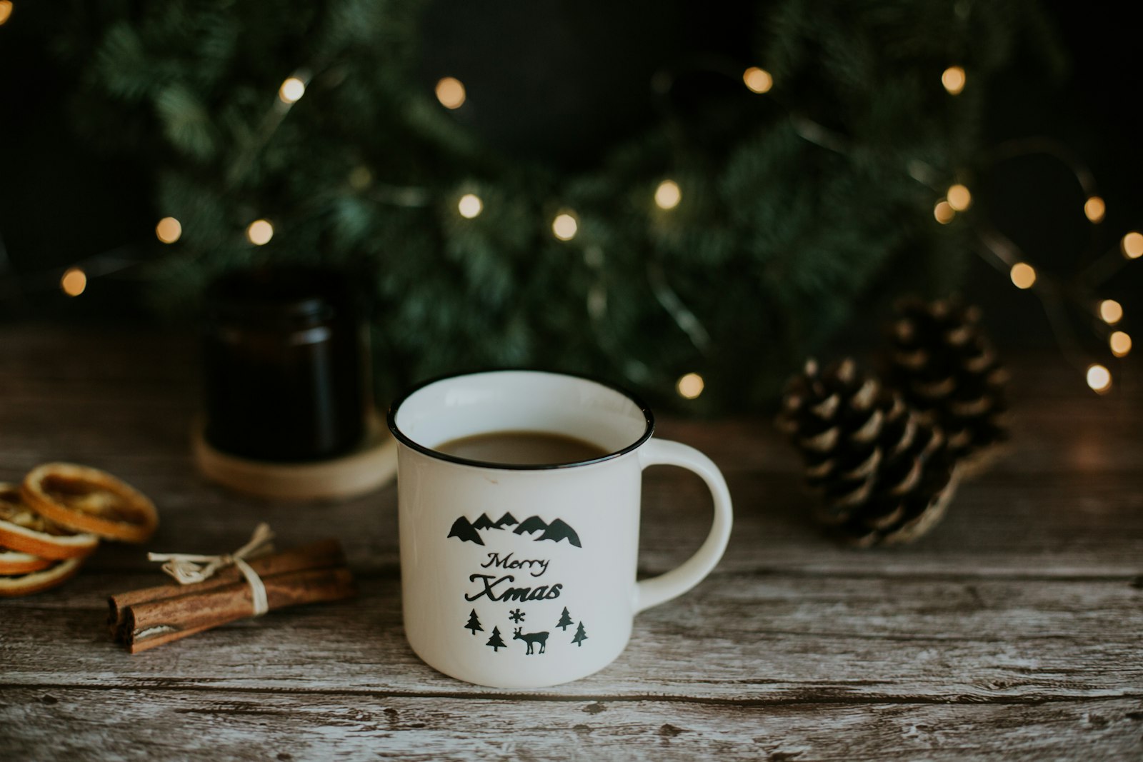 Hot spiced coffee in a glass with floated cream and grated nutmeg