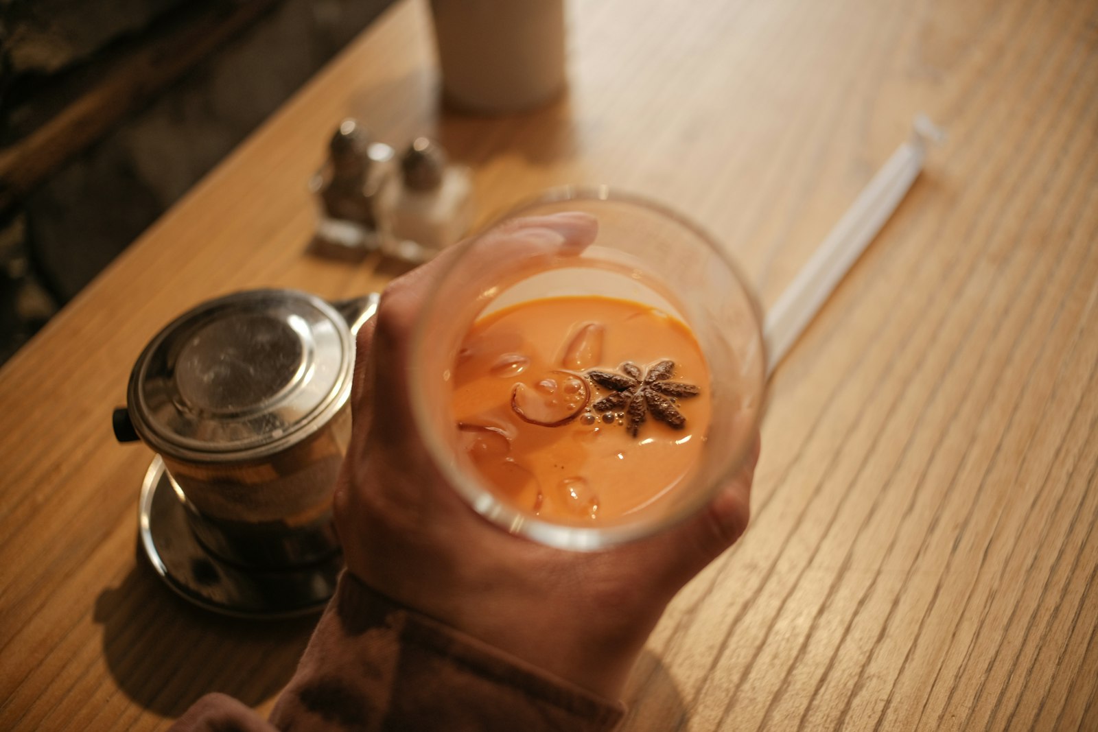 Hot vanilla bourbon in a glass with lemon slice and cinnamon stick