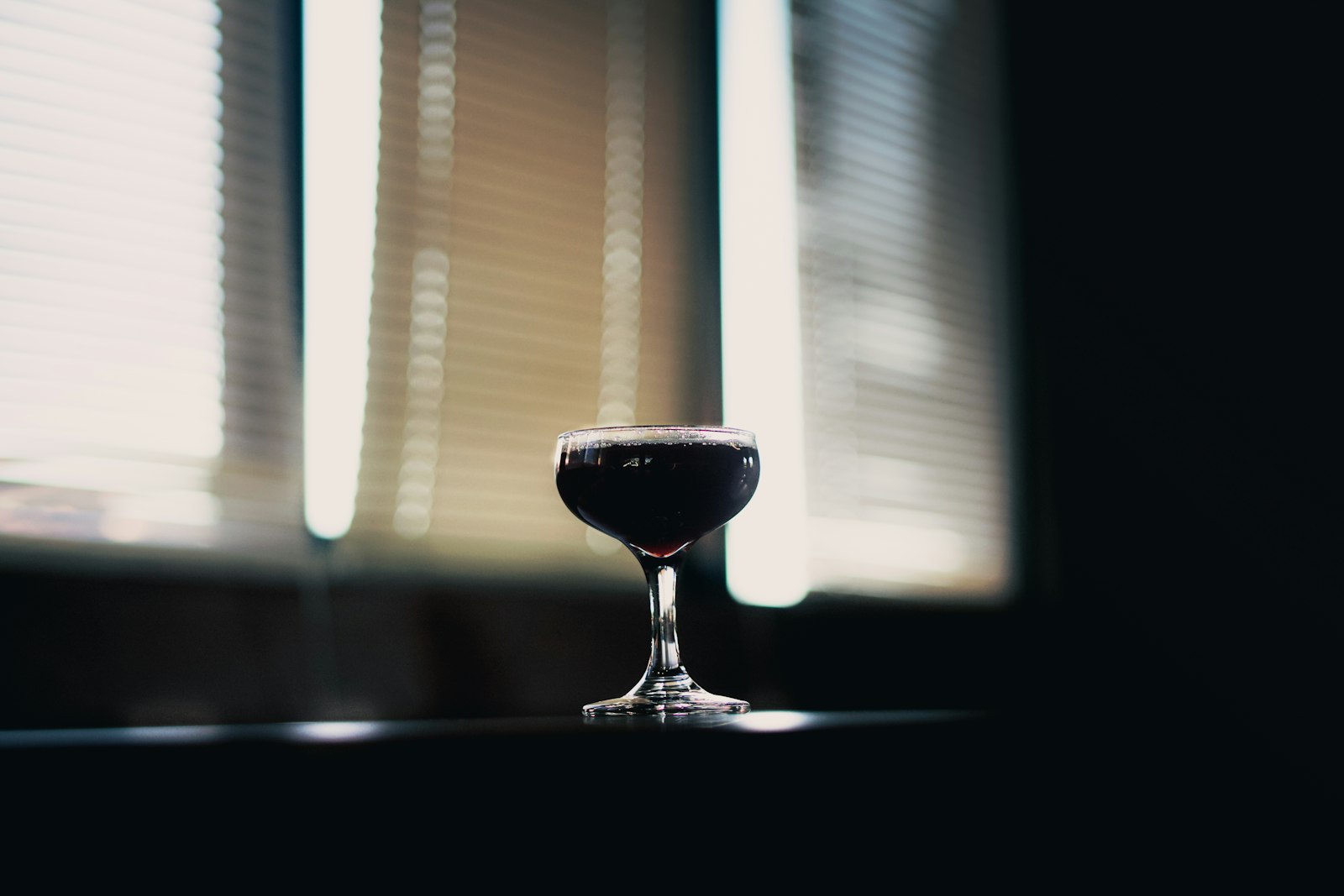Heatproof glass of session mulled wine with cinnamon stick and orange peel