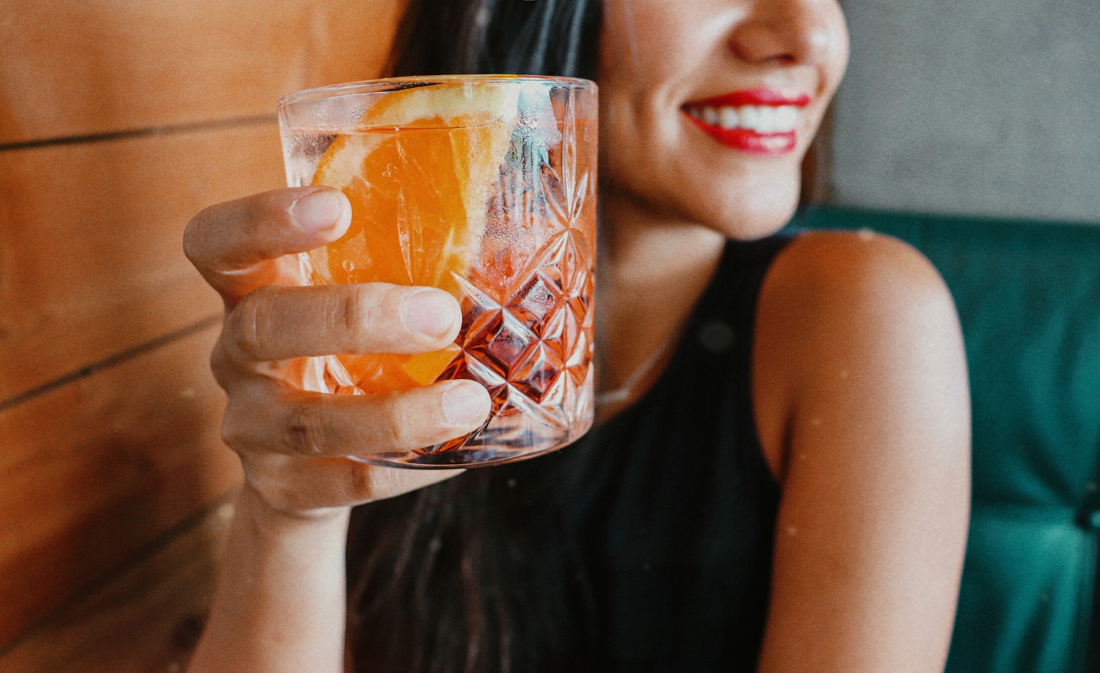 A ruby-red spiced Negroni over a large ice cube with a twist of orange peel.