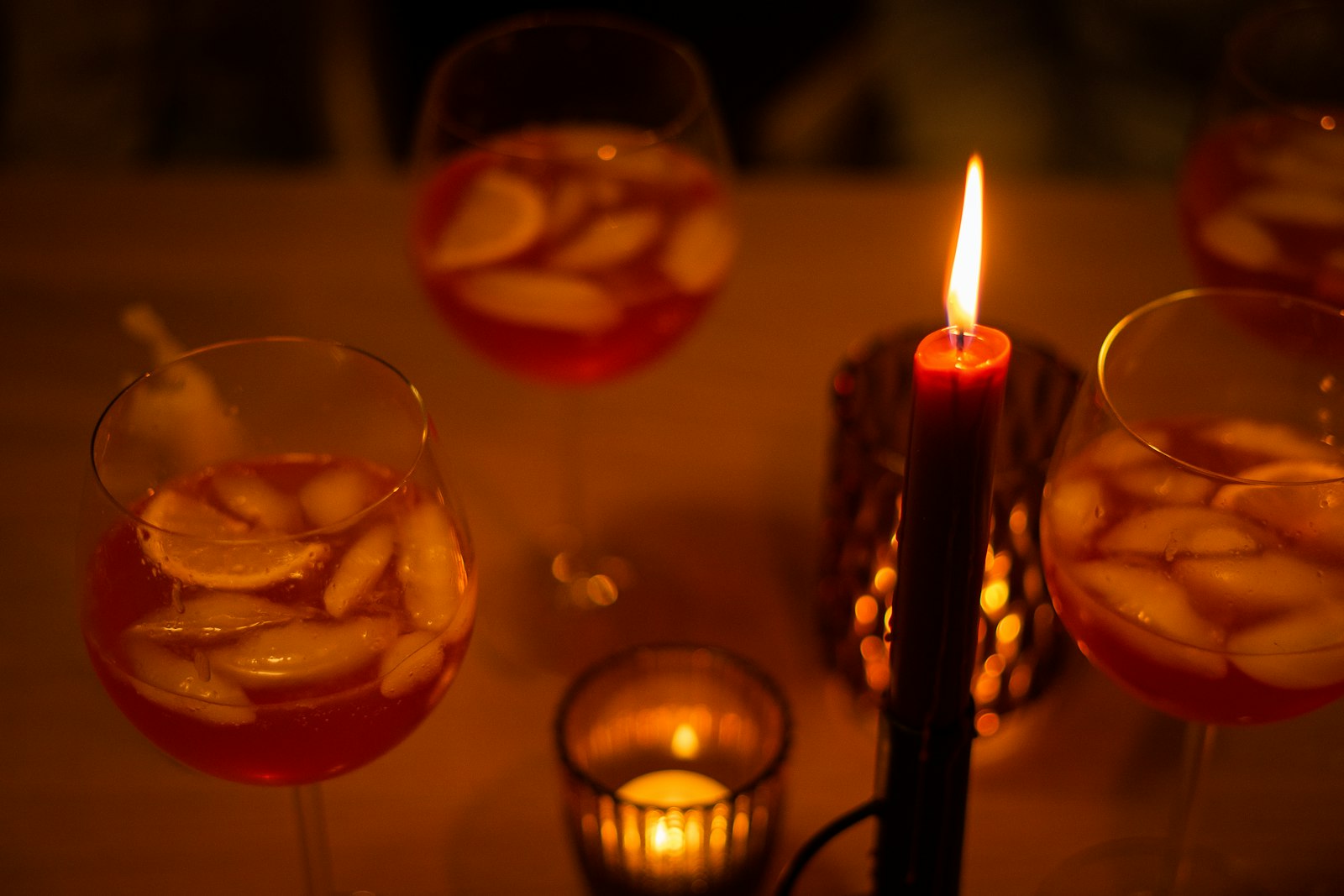 A heatproof glass of Italian vin brûlé with orange peel, a cinnamon stick and star anise.
