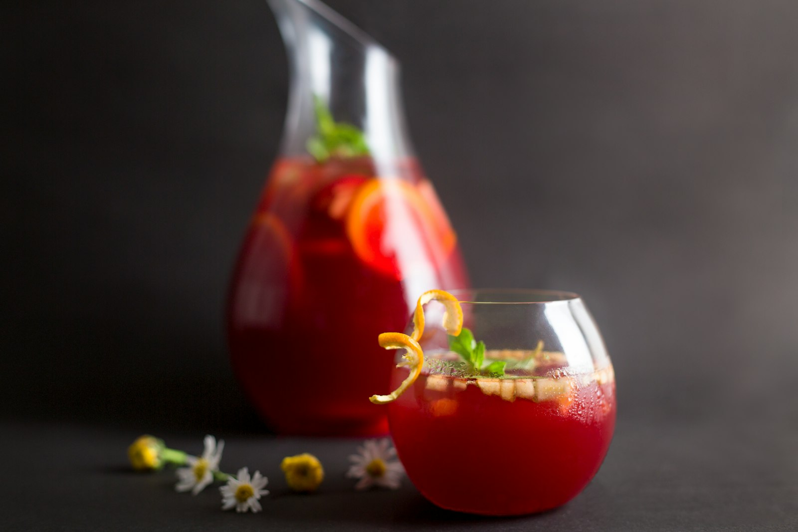 Winter sangria with red wine, fresh apple and orange slices and warming spices